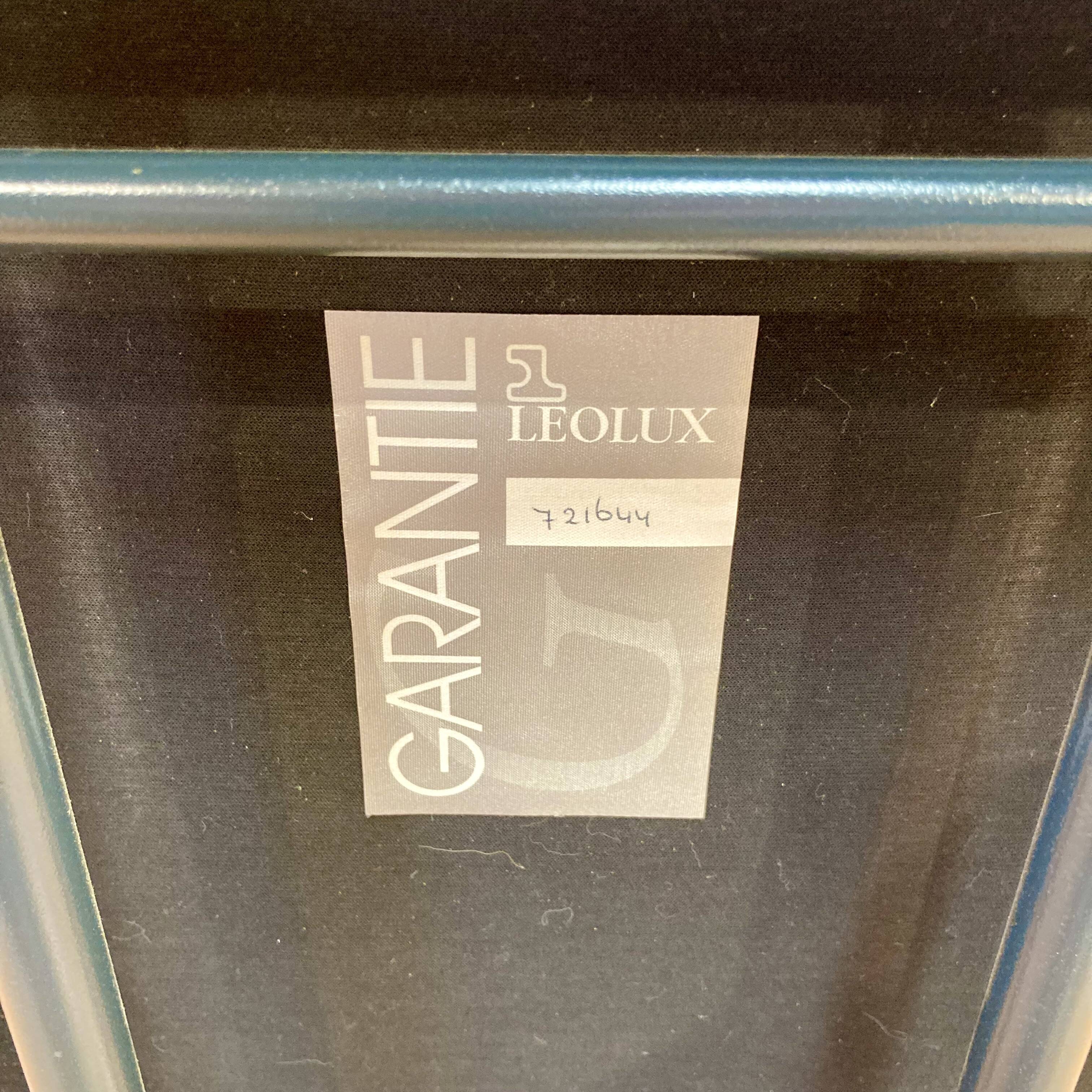 Design armchair in leather and metal.