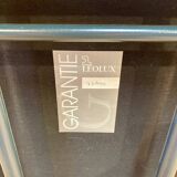 Design armchair in leather and metal.