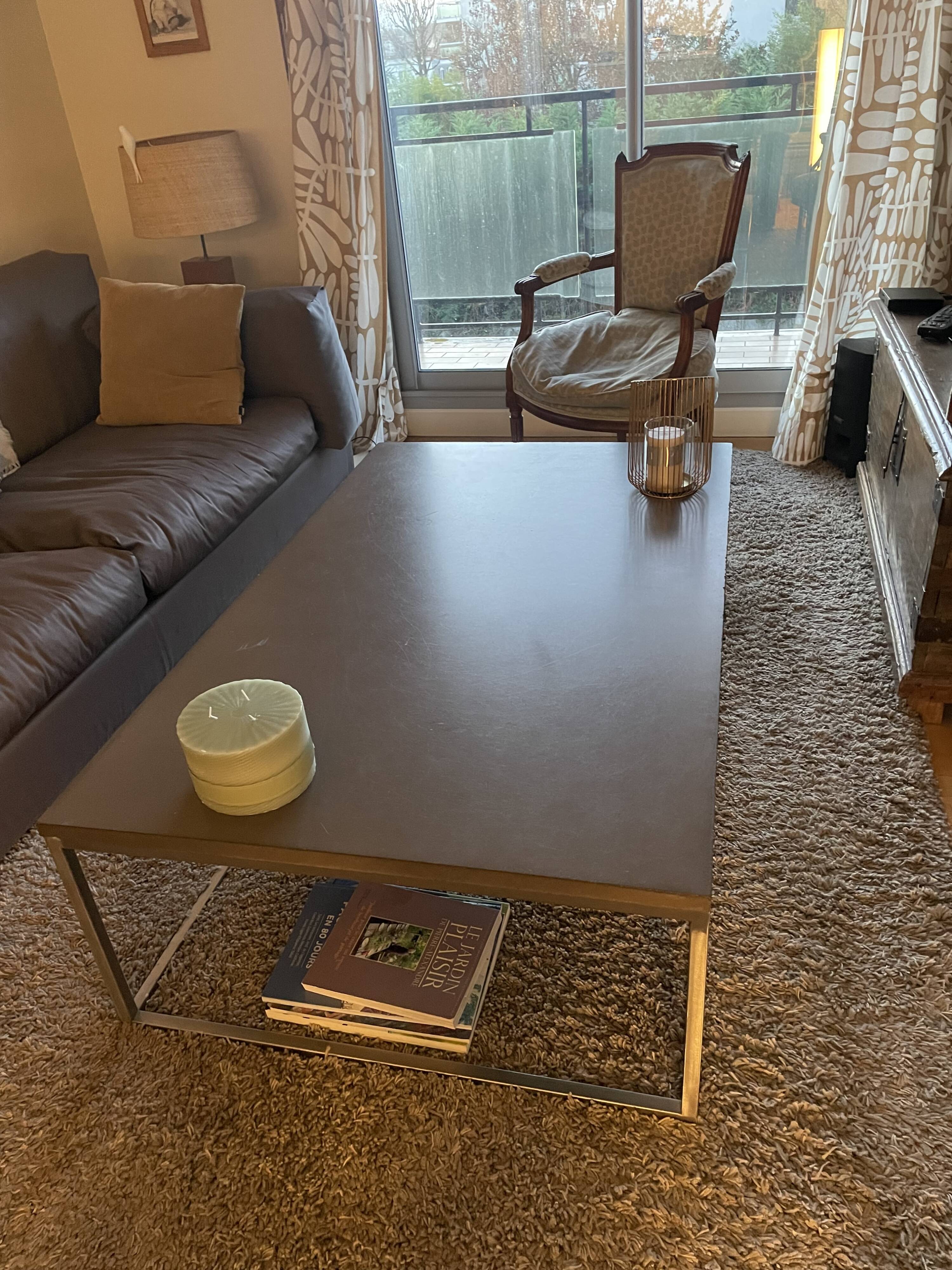 Coffee table in stone and brushed steel