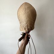 Woven rattan wall light in the style of Igno Maurer, design from the 1970s.
