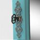 Beveled mirror on turquoise Parisian door