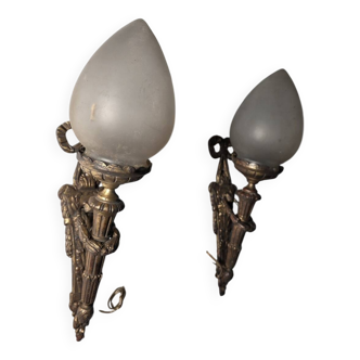 Pair of torch wall lights in Louis XVI style in 19th-century bronze.