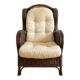 Vintage armchair in rattan and wicker with beige cushion.