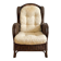 Vintage armchair in rattan and wicker with beige cushion.