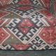 Victorian canapé upholstered in Kilim with turned mahogany legs.