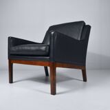 Leather and rosewood armchair by Kai lyngfeldt-Larsen. Denmark