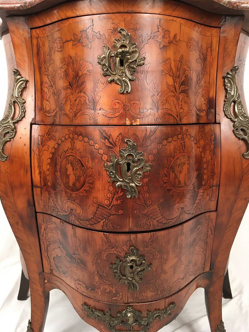 Louis XV style chest of drawers, richly inlaid, animated front and side. 19th century