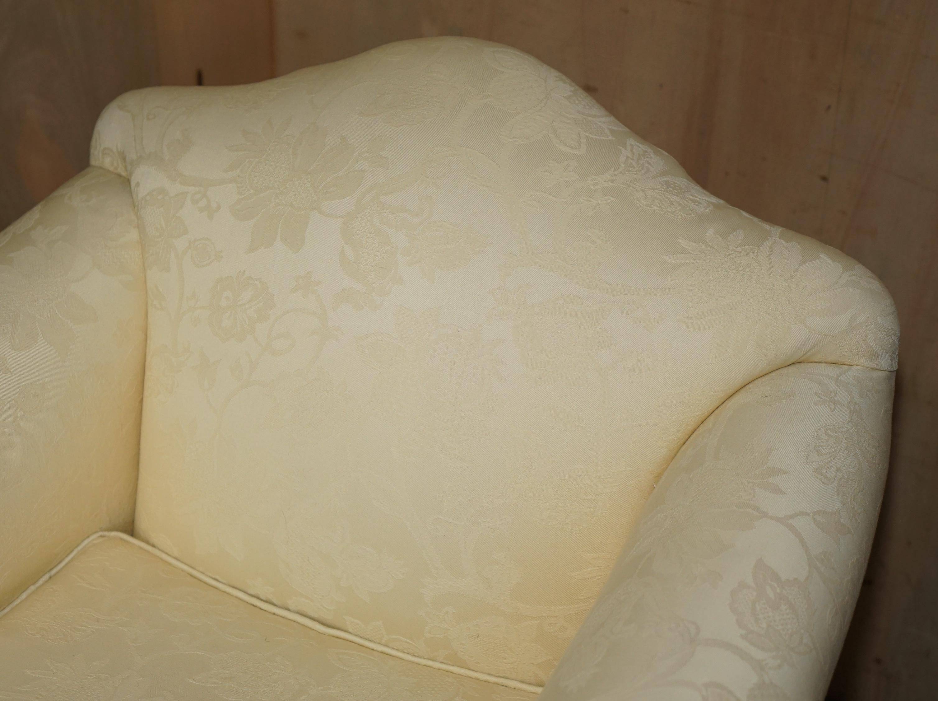 Pair of Edwardian armchairs from 1910 with carved legs and fabric.