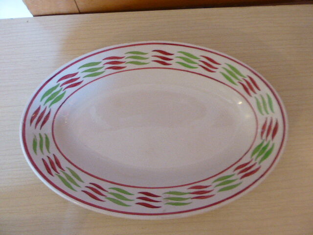 Service dish, in earthenware geometric patterns red and vintage green, stamped KG Luneville