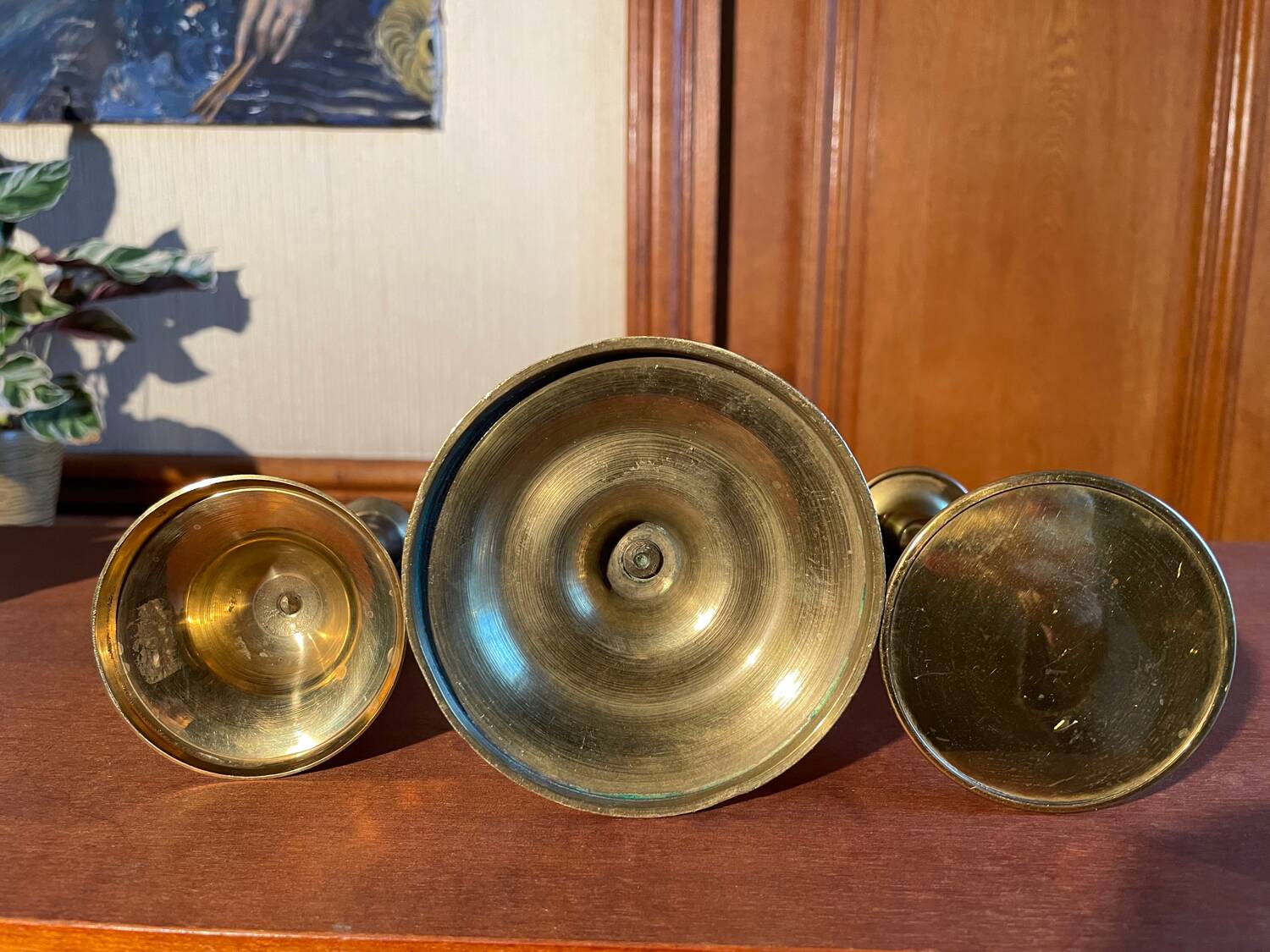 Trio of brass candlesticks