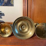 Trio of brass candlesticks