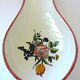 Repose-cuillère à décor floral en faïence d'Angoulême