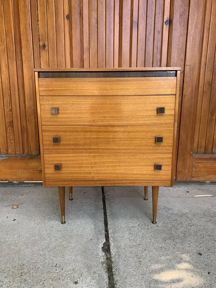 Mid-century brown teak chest of drawers with three drawers, tapered legs from the 1960s.