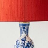 Pair of Royal Delft blue and white ceramic table lamps with new vermilion silk shades.