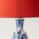 Pair of Royal Delft blue and white ceramic table lamps with new vermilion silk shades.