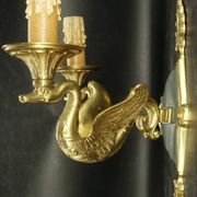 Pair of Empire style wall sconces with swans by Petitot - bronze & green patina