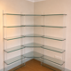 Library/shelves in tempered glass, plexiglass and brass Marais intern.