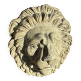 Off-white plaster lion head relief on natural wood panel — Walter De Buck, classical decorative sculpture