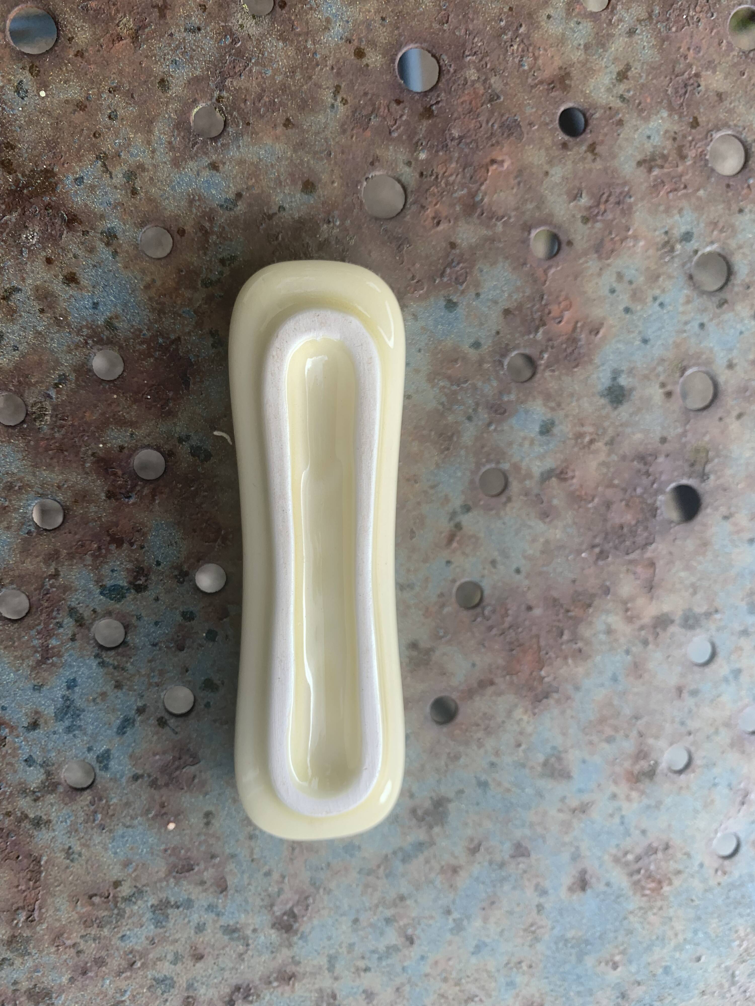 Set of 12 knife holders in green and beige glazed ceramic, slip,