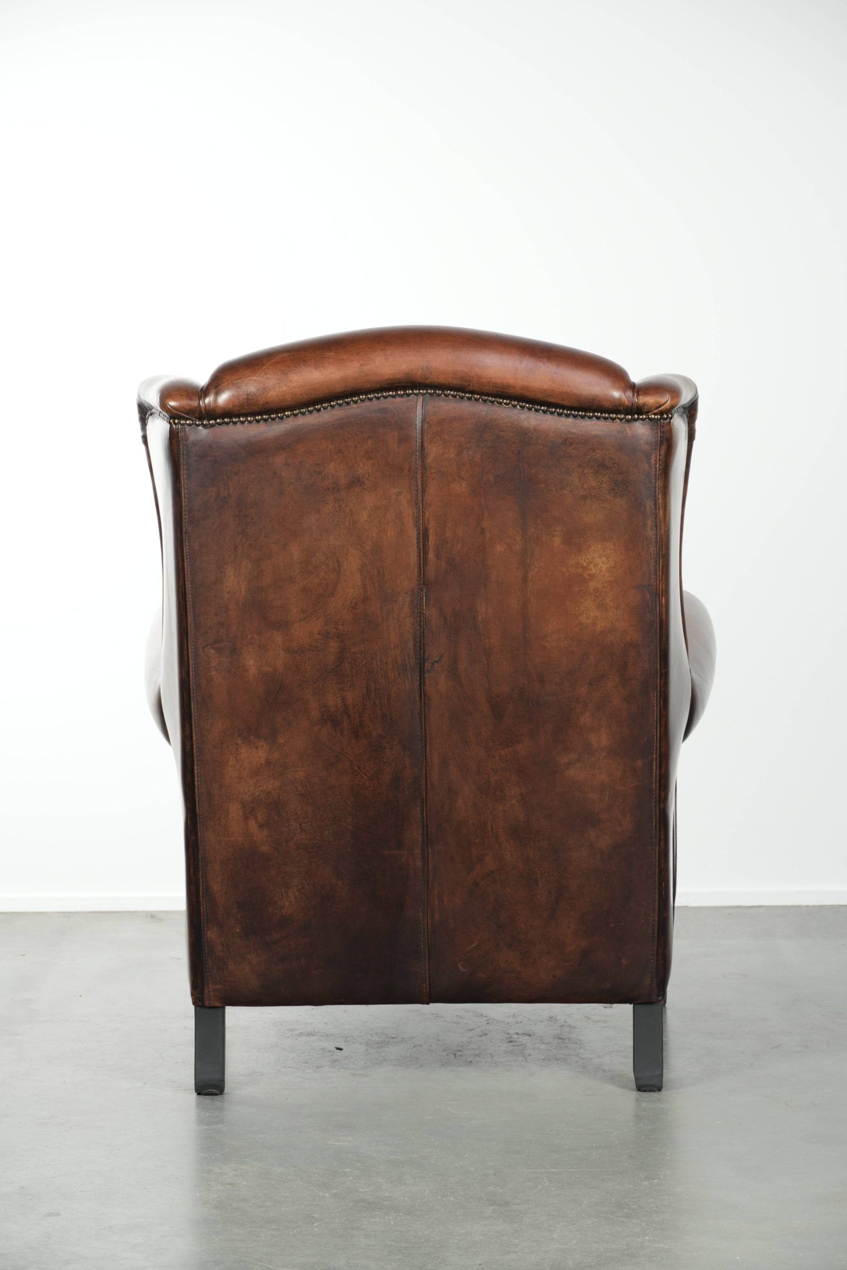 Sheepskin wingback armchair with beautiful deep and warm colours