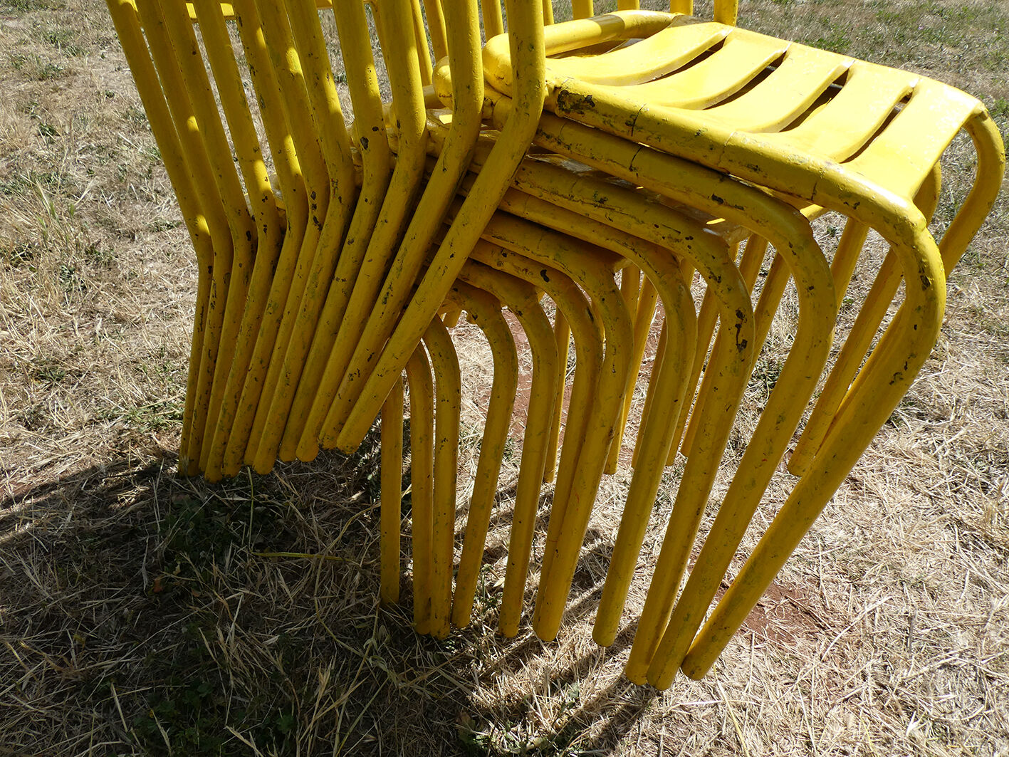 Lot of 11 yellow metallic bistro chairs from the 1950s
