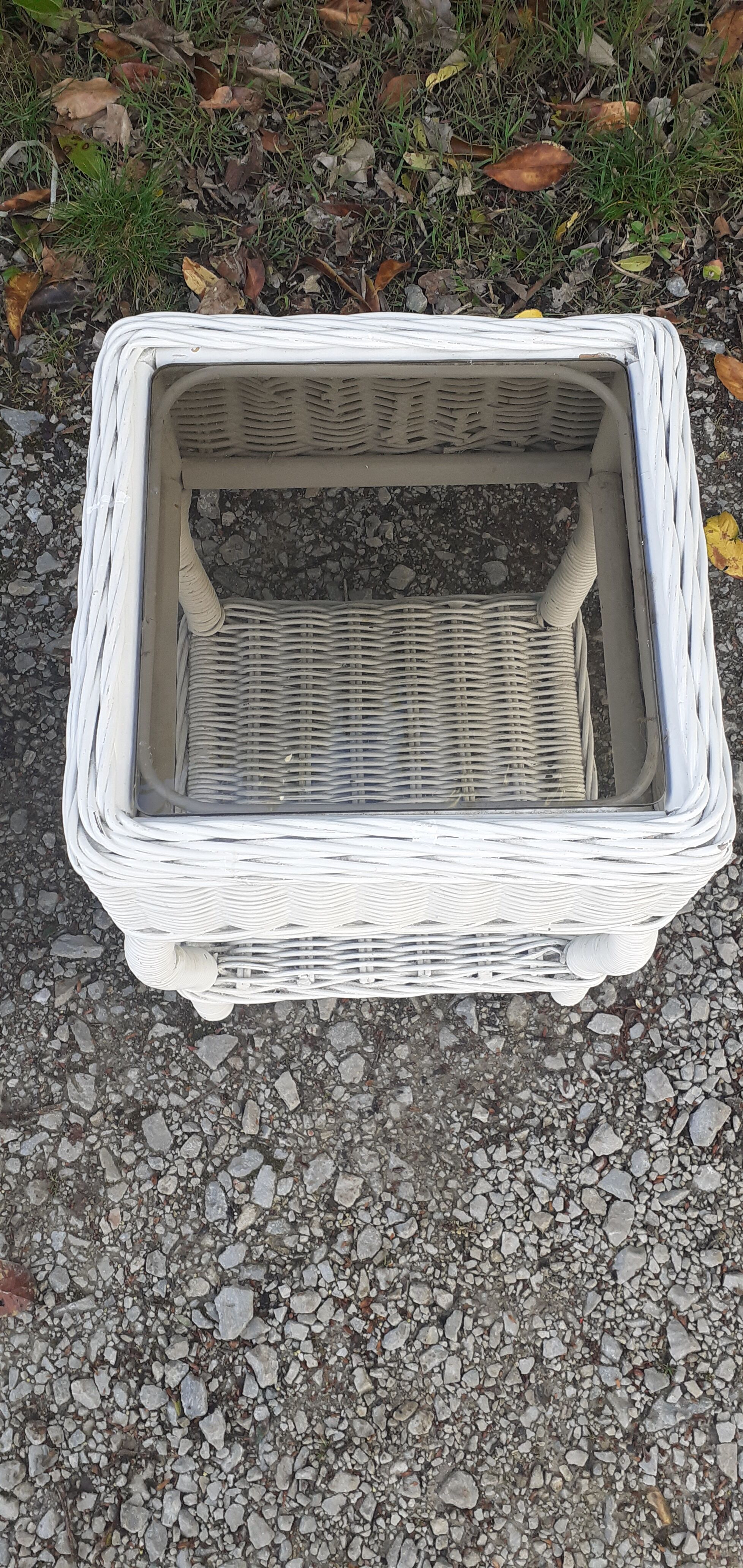 Pairs of white rattan side tables and smoked glass