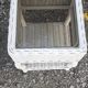 Pairs of white rattan side tables and smoked glass