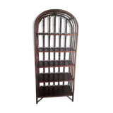 Library shelves in dark rattan