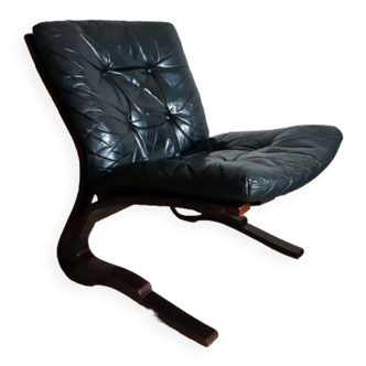 Scandinavian armchair black leather and rosewood by Elsa and Nordahl Solheim, 70s.