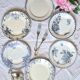 Old mismatched flat plates made of ironstone earthenware.