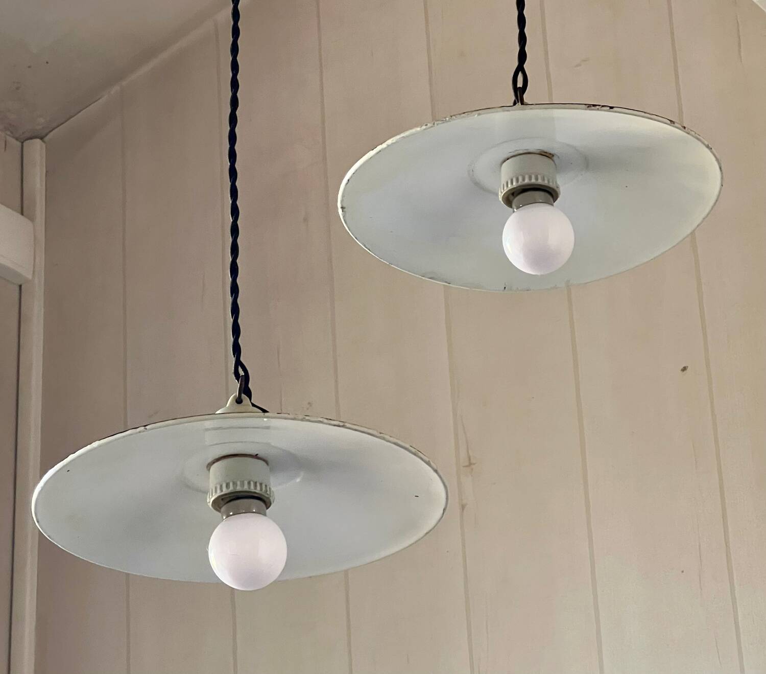 Pair of black and white sheet metal pendant lights, ceramic sockets