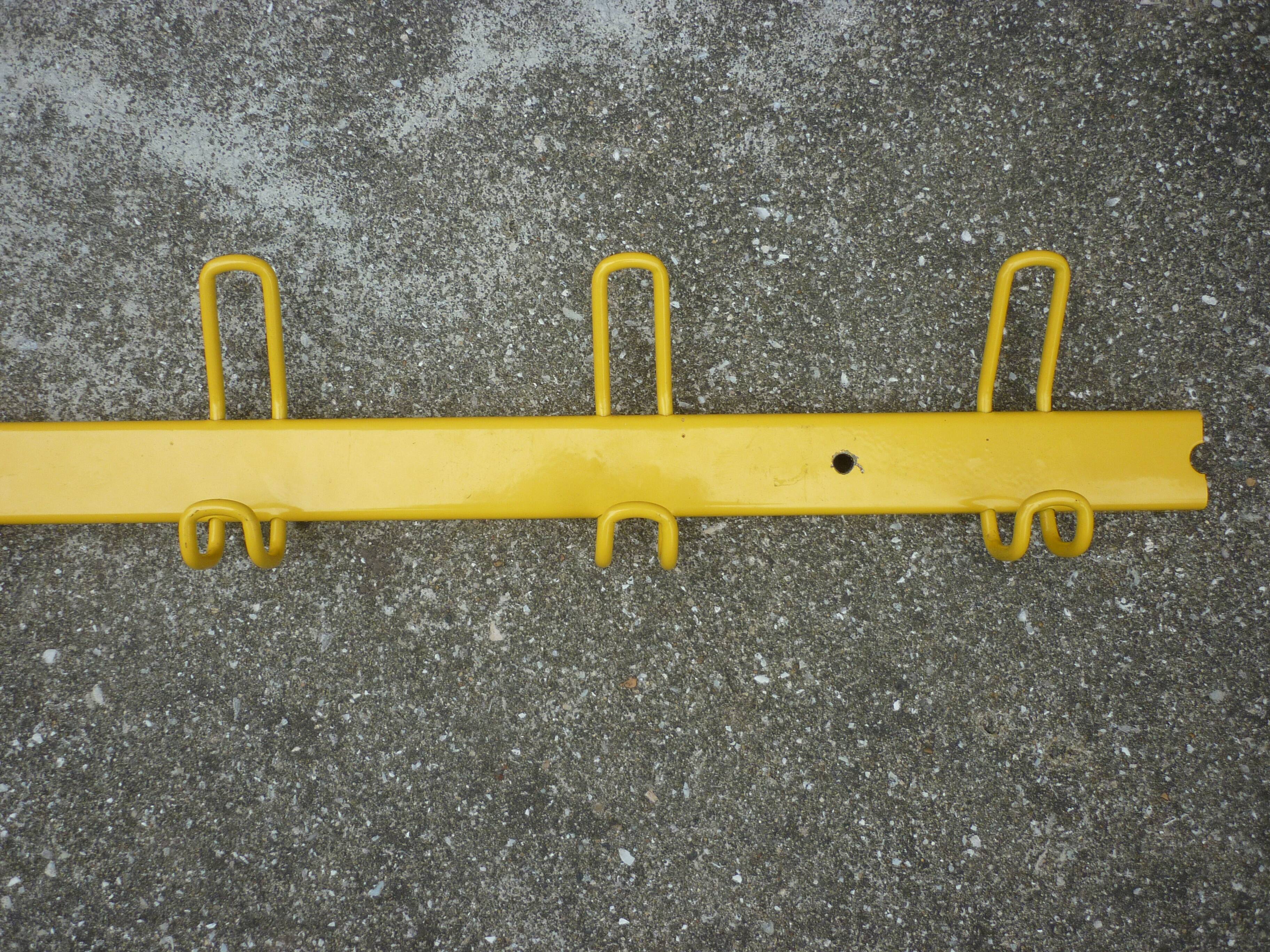 Yellow metal wall coat holder
