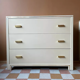 Commode Hollywood Regency crème par Pierre Vandel
