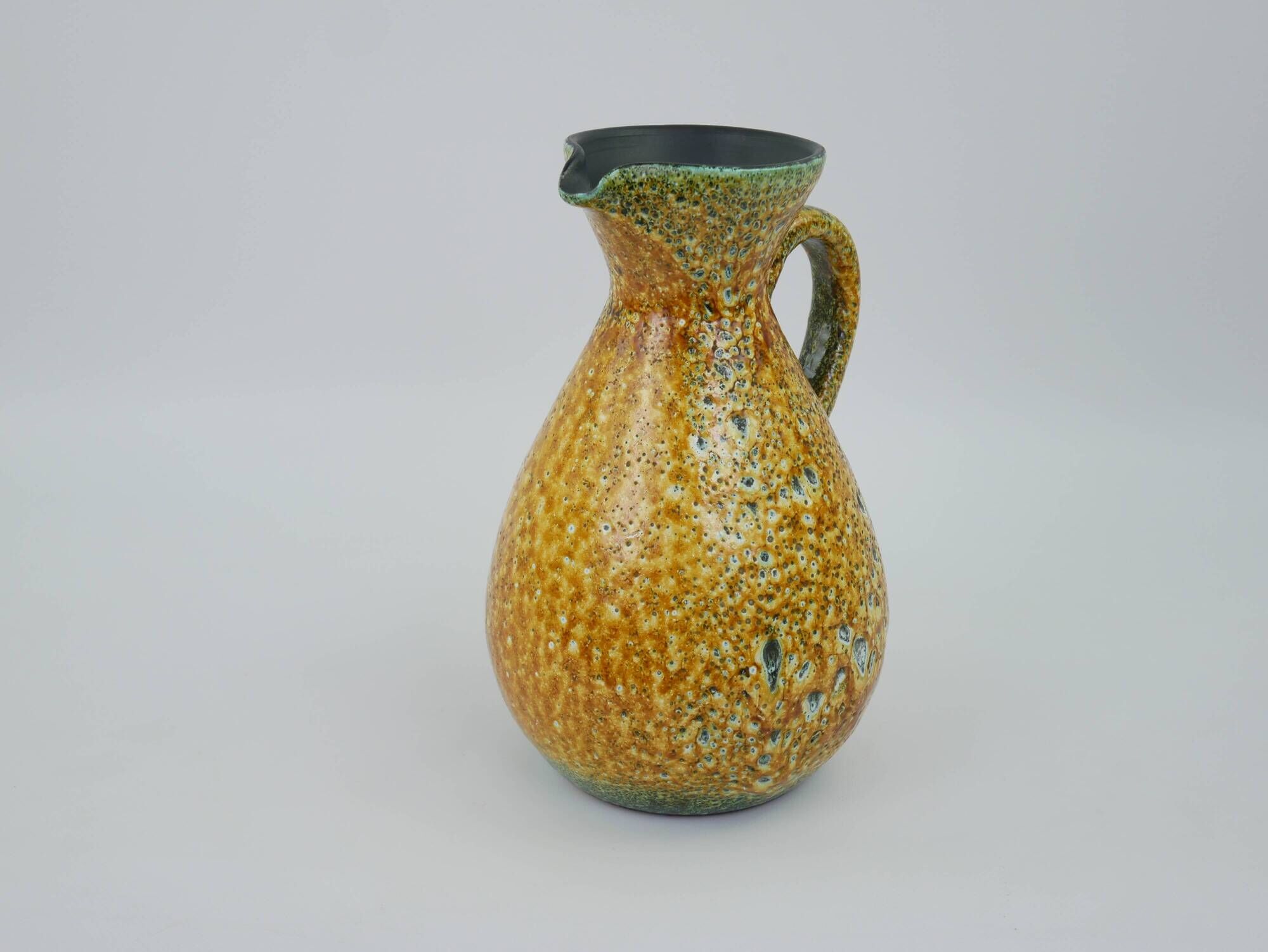 Large yellow ceramic pitcher in the Accolay style
