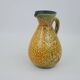 Large yellow ceramic pitcher in the Accolay style