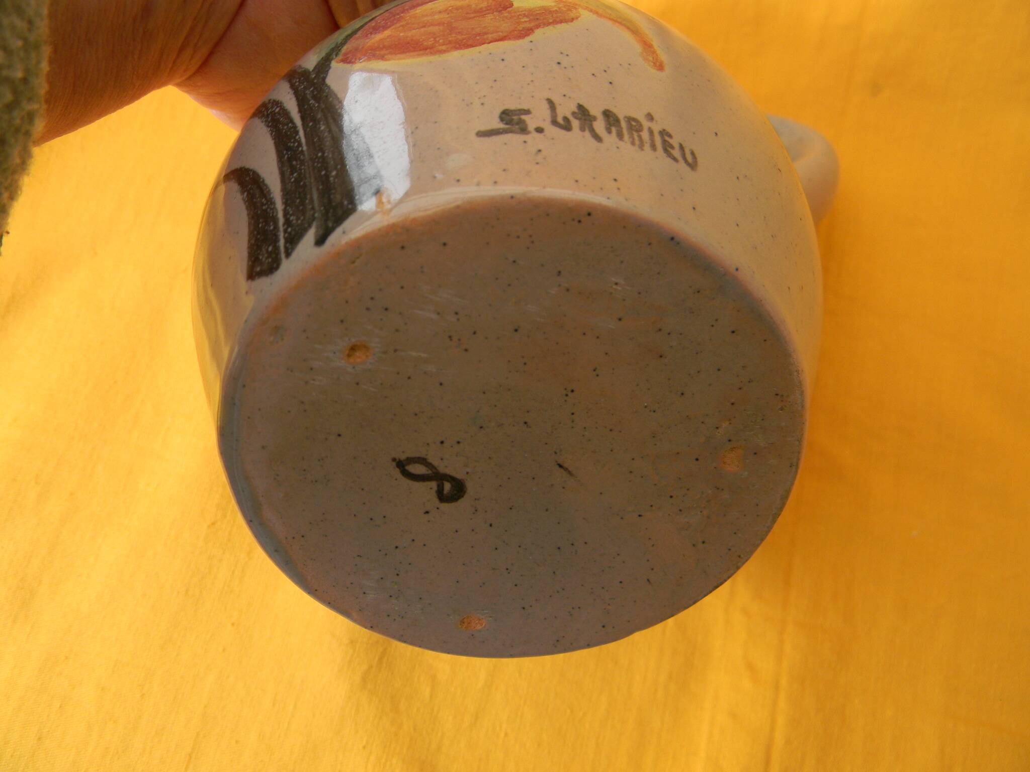 Ceramic pitcher by simone larrieu.