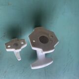 Two white porcelain coat hooks, one small and one larger, old