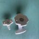 Two white porcelain coat hooks, one small and one larger, old