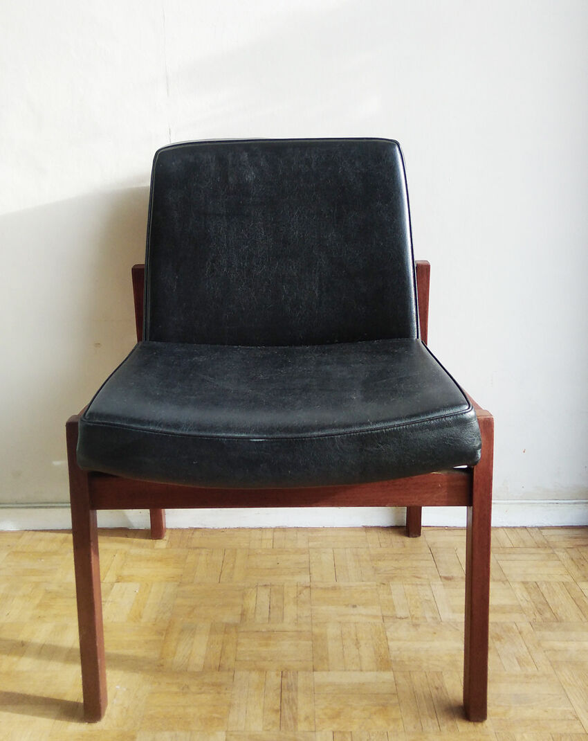 Massive teak and black skai armchair from the 1960s