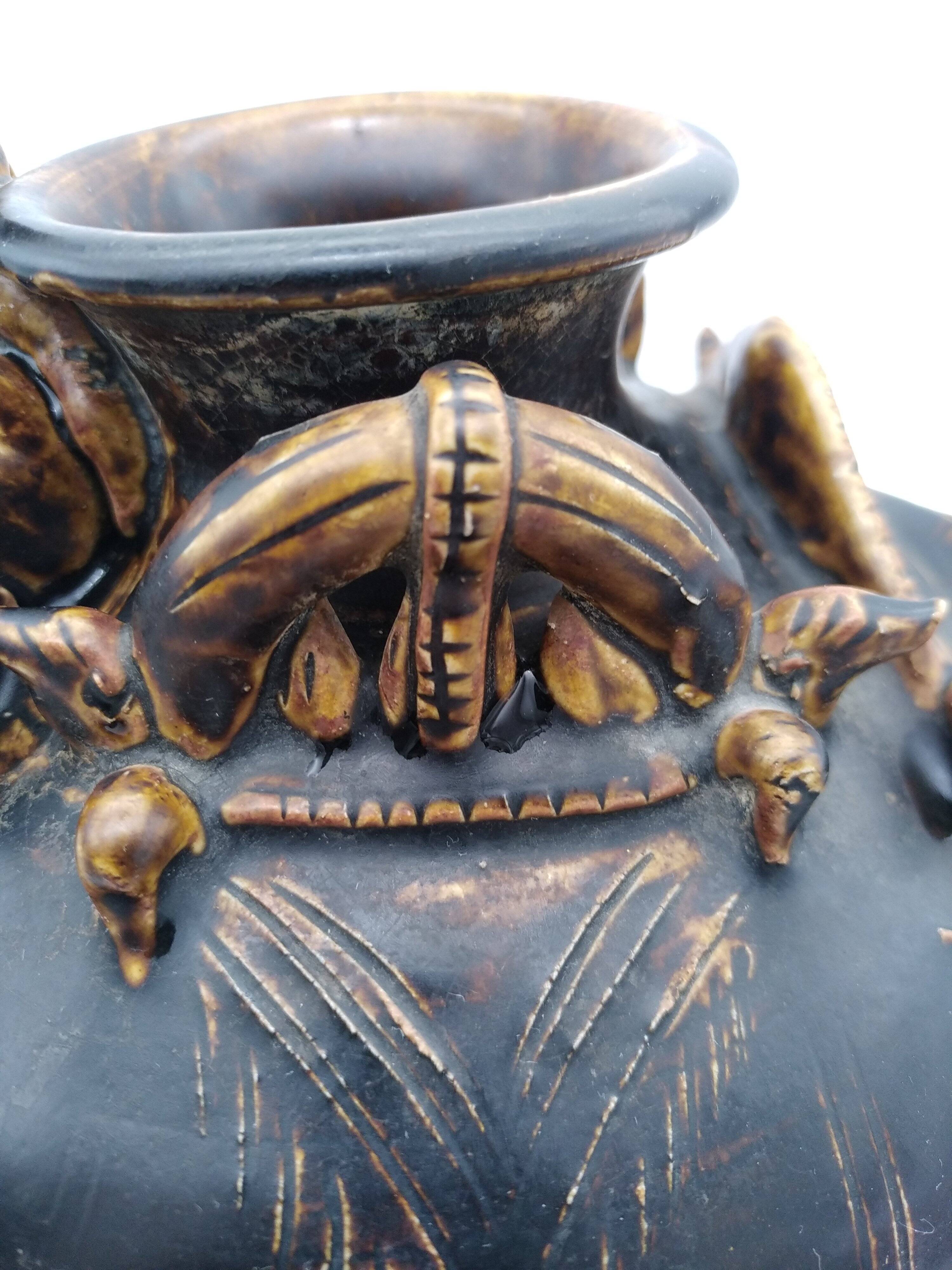 Antique Khmer ceramic vase. With elephant decoration.