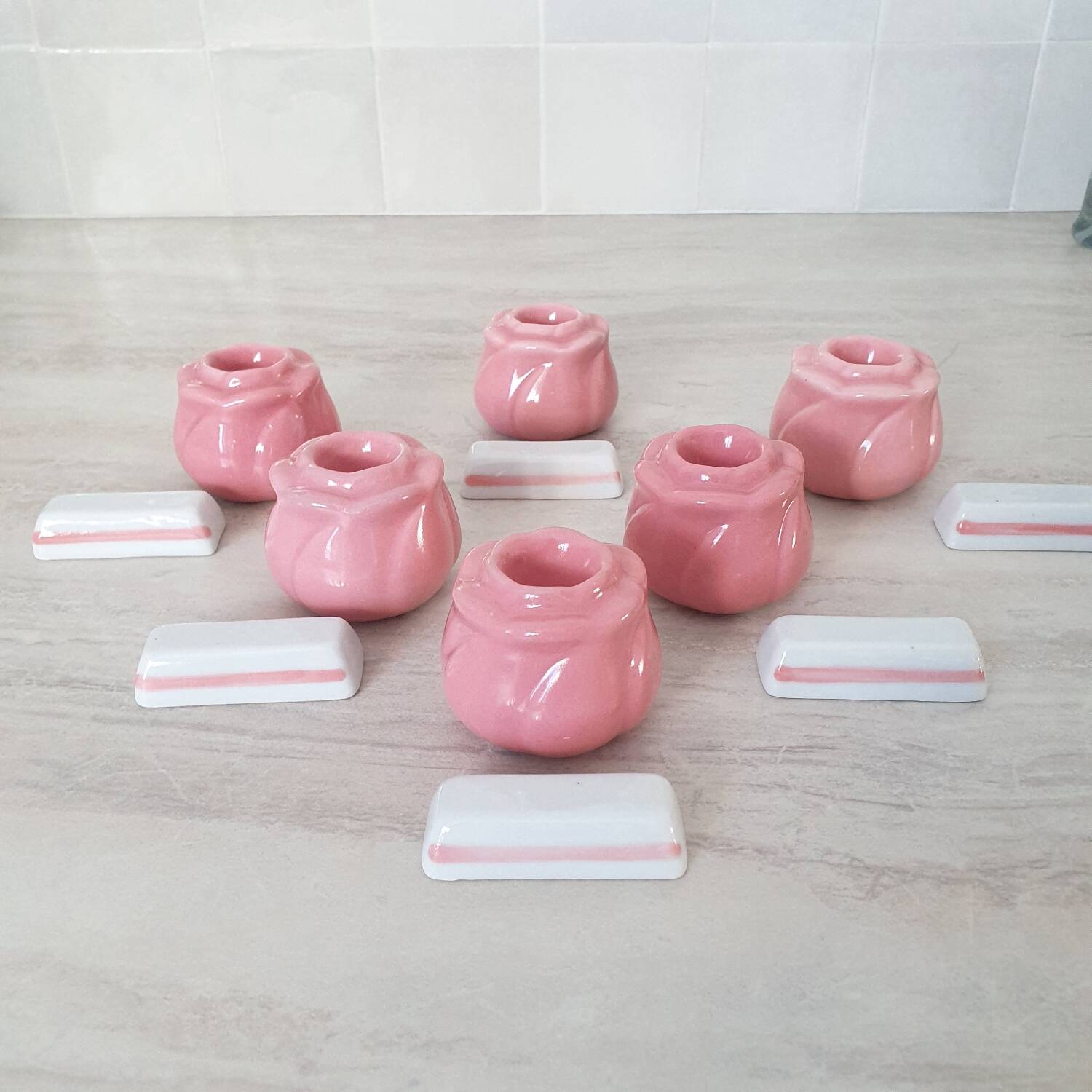Pink candlesticks and porcelain knife holders
