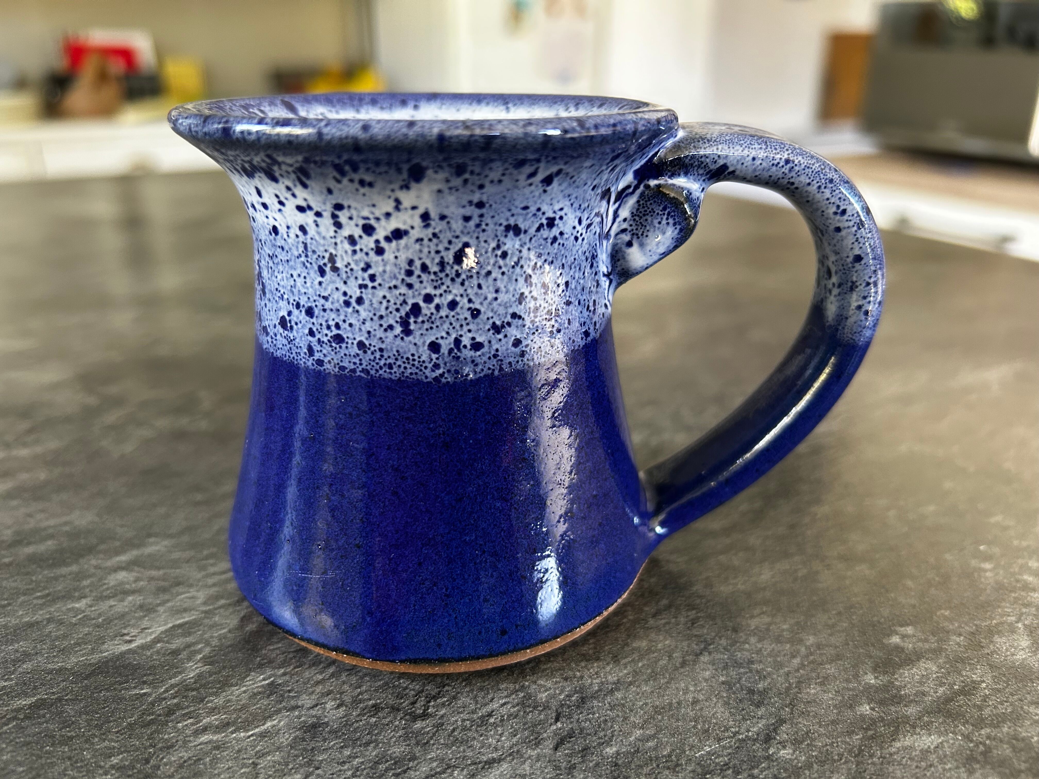 Small enamelled earthenware milk jug