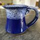 Small enamelled earthenware milk jug