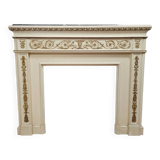 Louis XVI fireplace made in the 19th century, all in lacquered and gilded wood with decorative attributes