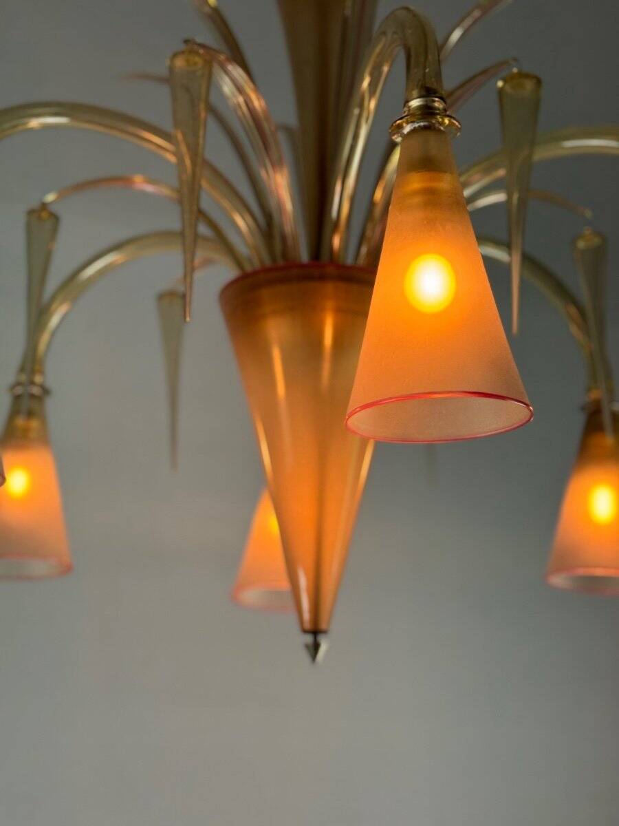Venetian chandelier in beige/gray murano glass bordered with a red net