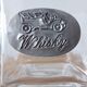 Glass and tin whiskey decanter