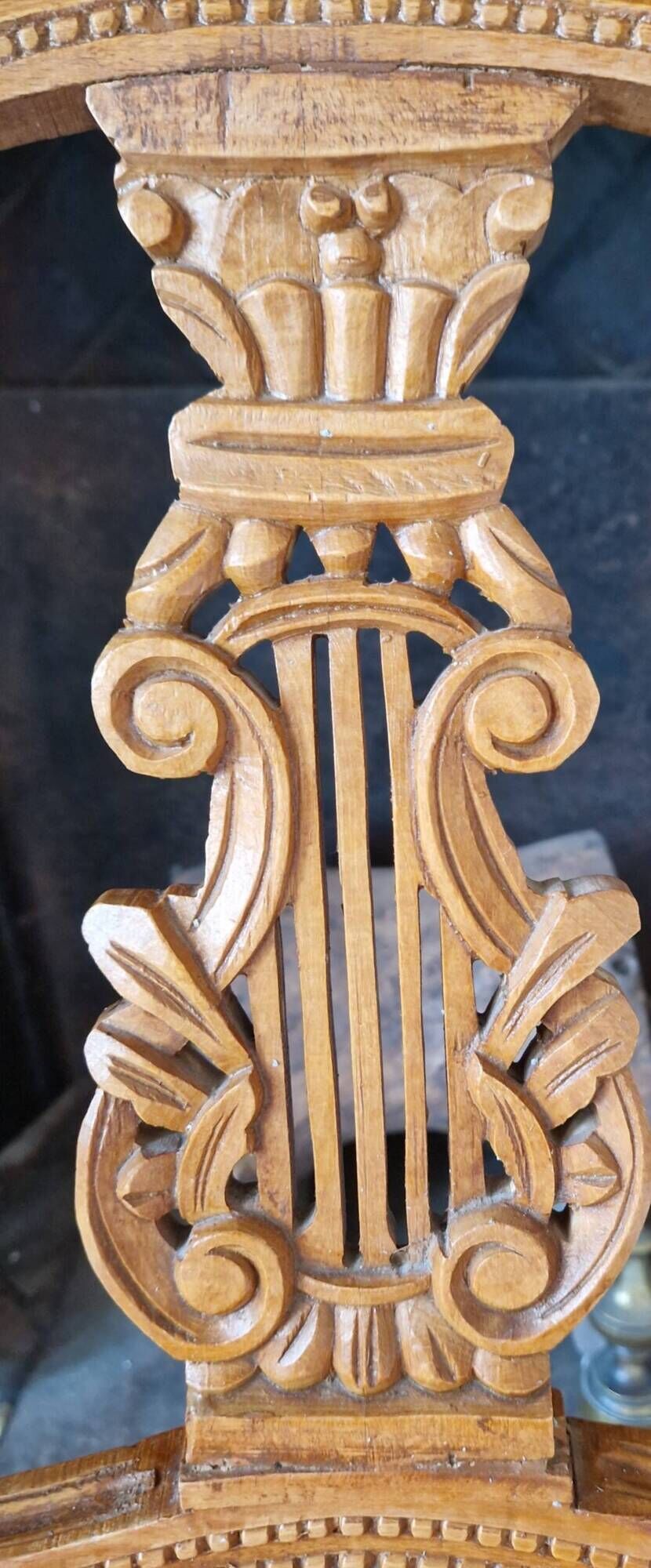 Lyre back chair in carved wood, Louis XVI style, late 19th century.