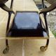 Chic serving table on wheels from the 60s with brass decorations and two shelves.