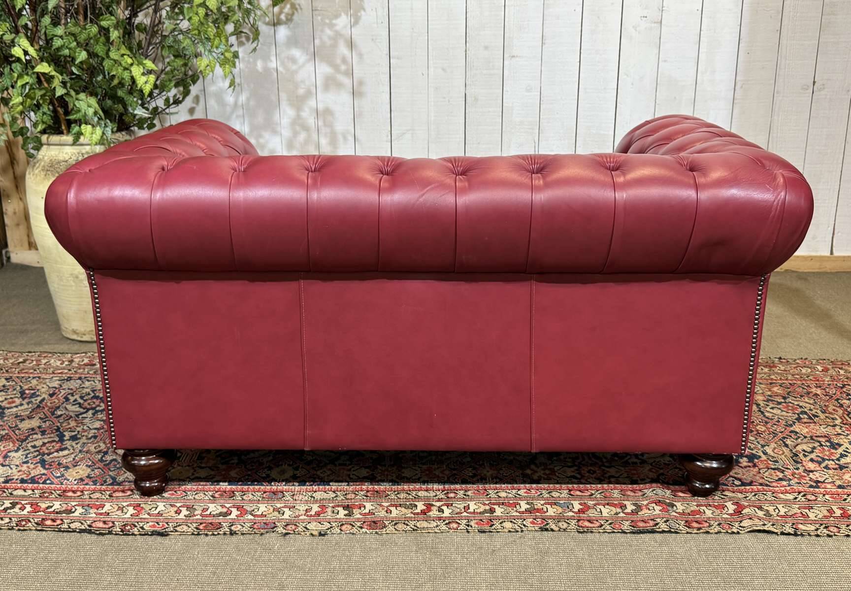 Chesterfield 2-seater leather sofa, modern production from the 2000s.