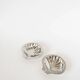 Pair of shell-shaped stainless steel catchalls, design, 1970